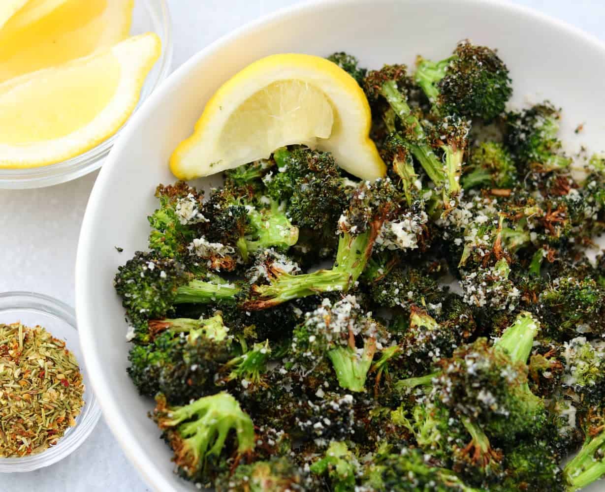 One bowl of broccoli with sliced lemon