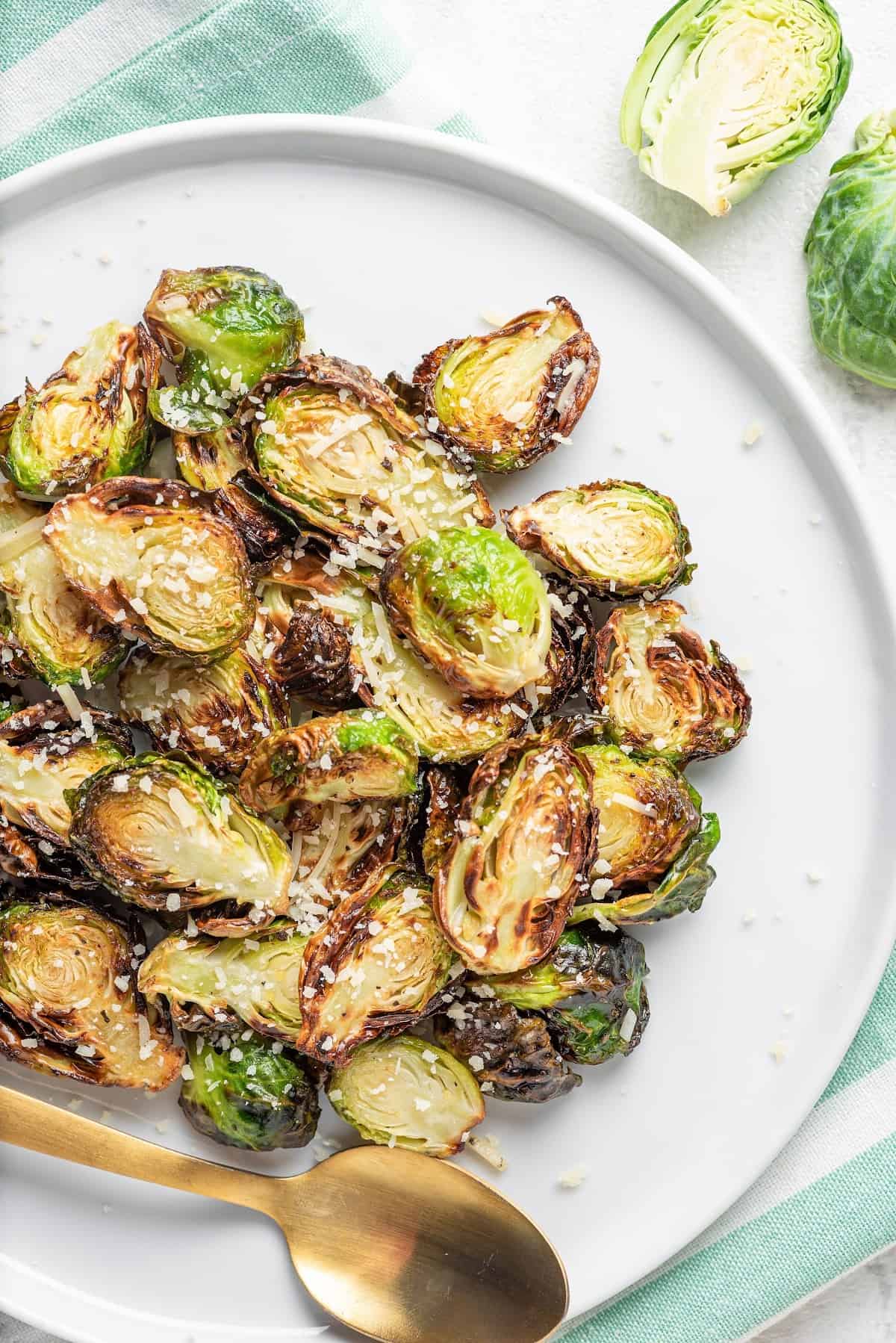 crispy Brussels sprouts on a plate with a spoon
