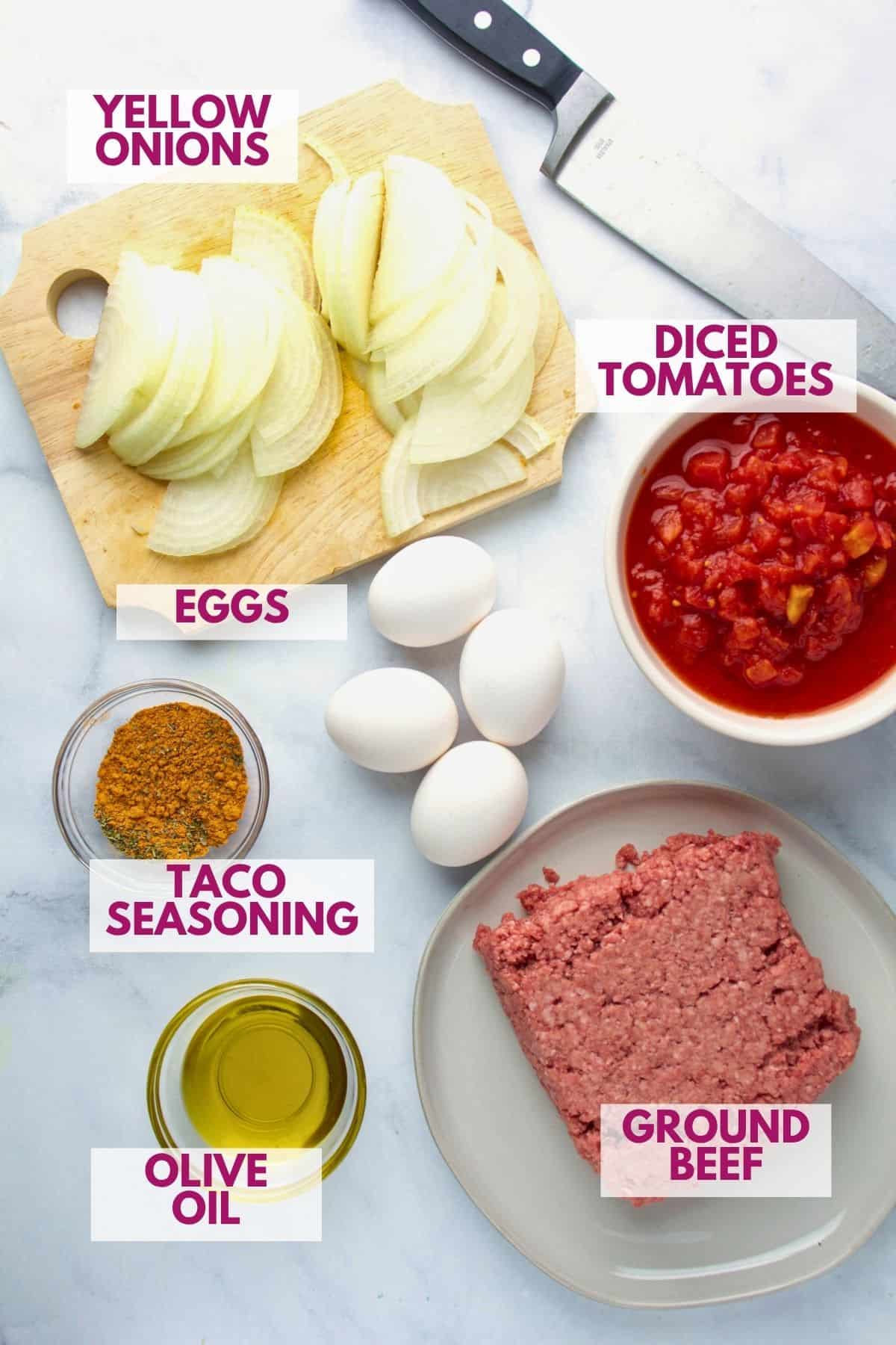 ingredients to make a breakfast taco bowl with ground beef on a kitchen counter