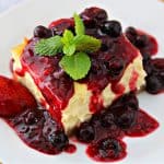 close-up of mixed berry cheesecake on a plate