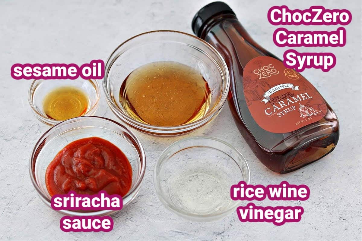 a photo of the four ingredients used to make keto Honey Sriracha sauce - sesame oil, sriracha sauce, honey substitute, and rice wine vinegar