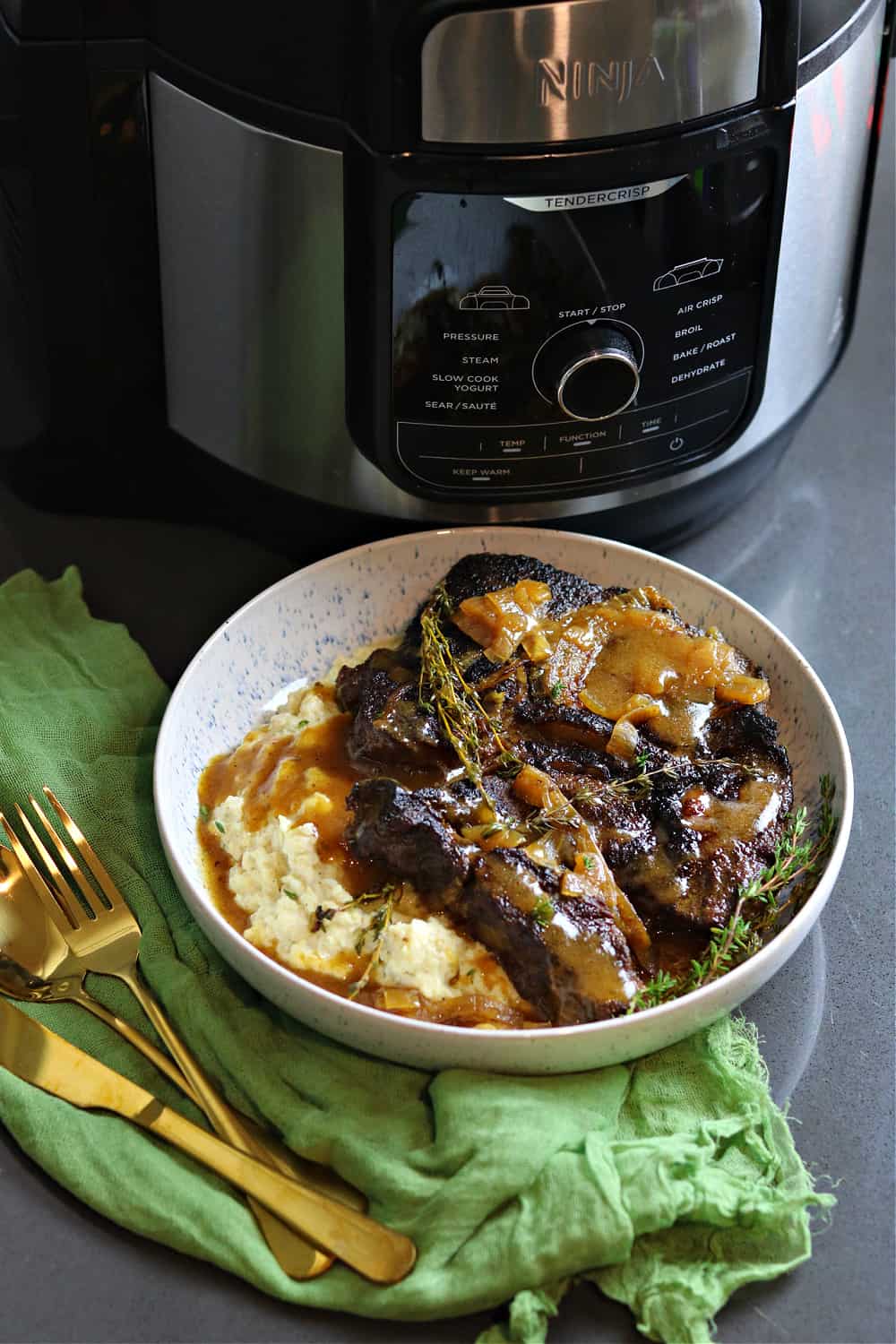 Beef Pot Roast in a bowl with mashed caulflower
