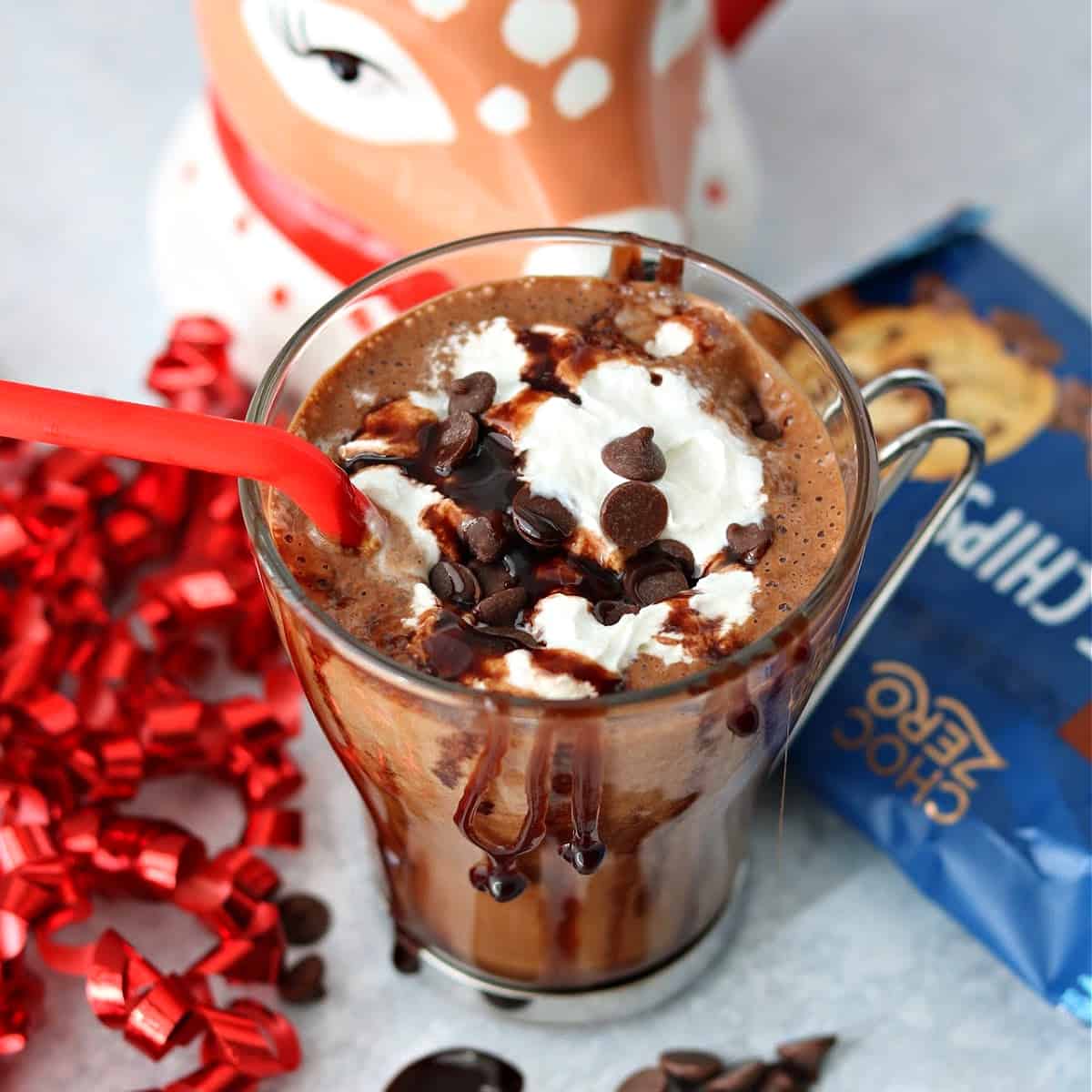 a close up of Peppermint Mocha in a glass mug with Choczero baking chips