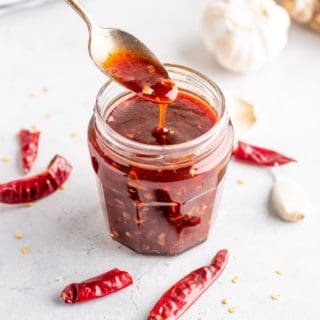 a close-up of sweet chili sauce in a glass jar