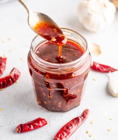 a close-up of sweet chili sauce in a glass jar