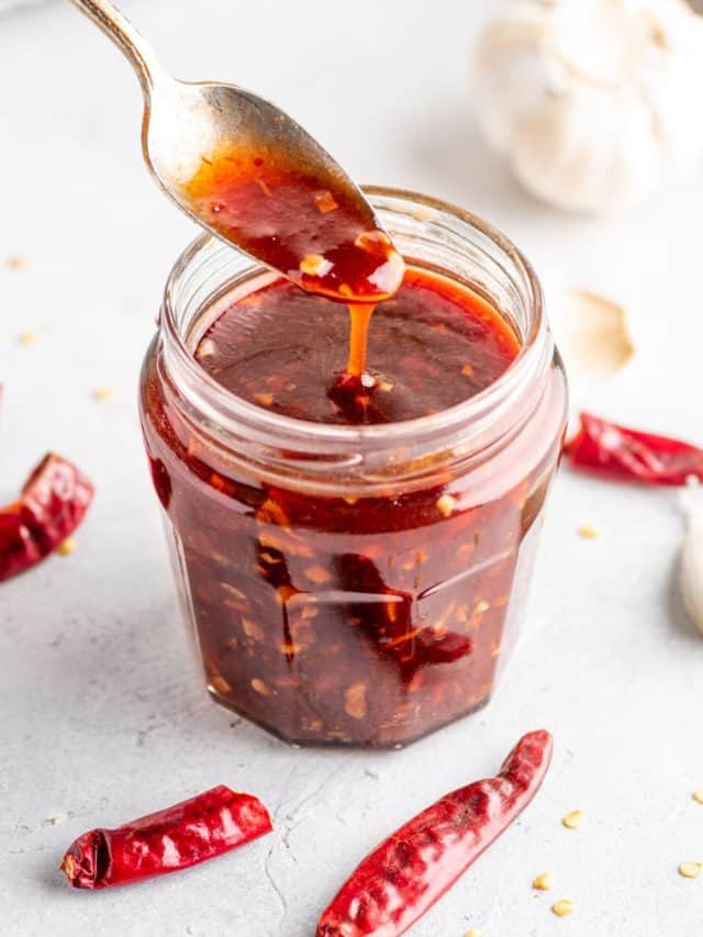 a close-up of sweet chili sauce in a glass jar