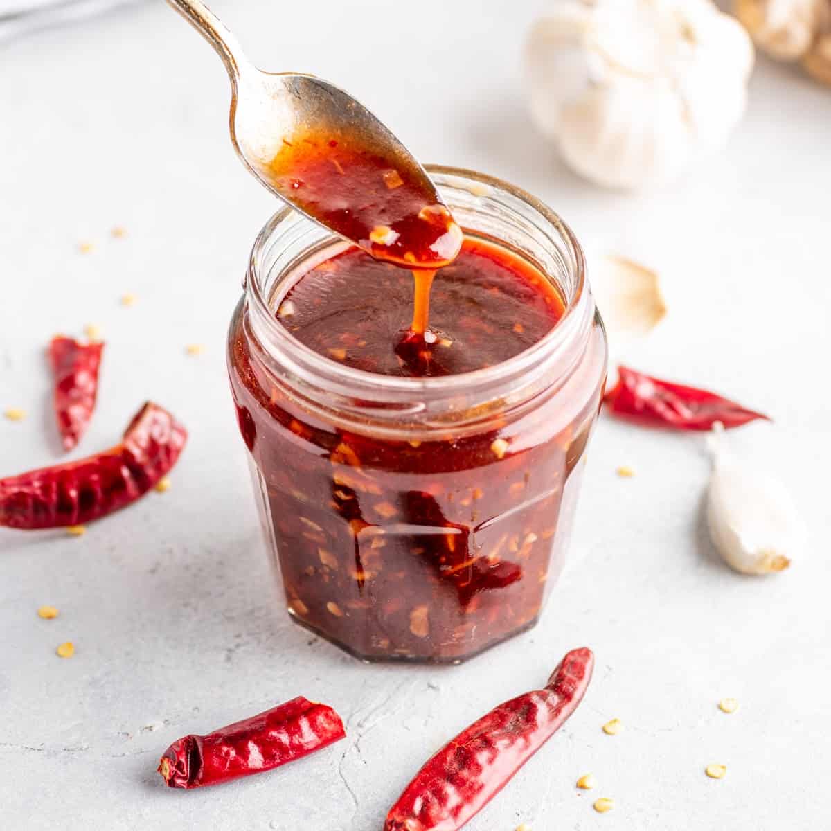 a close-up of sweet chili sauce in a glass jar