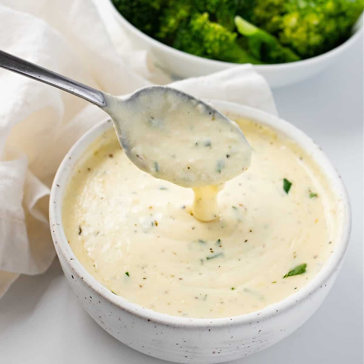 a bowl of Keto Alfredo sauce with broccoli
