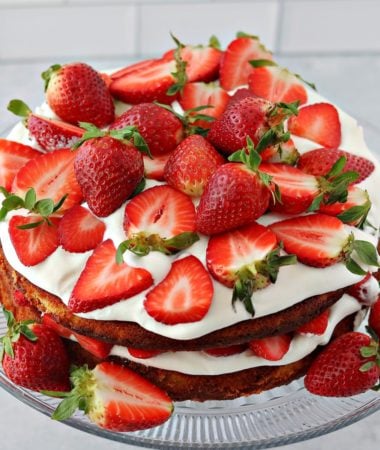 double layer low carb strawberry shortcake on a cake stand