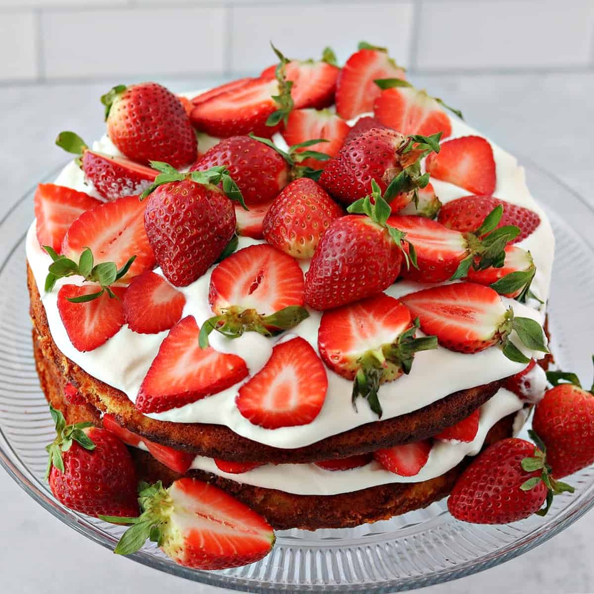 double layer low carb strawberry shortcake on a cake stand