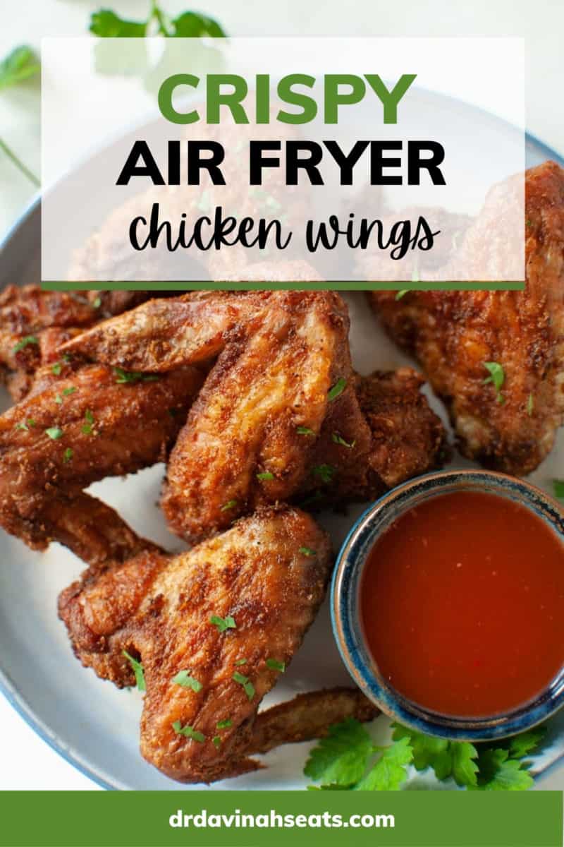 Poster with a picture of chicken wings on a plate with a bowl of sauce, with a banner that says "Crispy Air Fryer Chicken Wings"