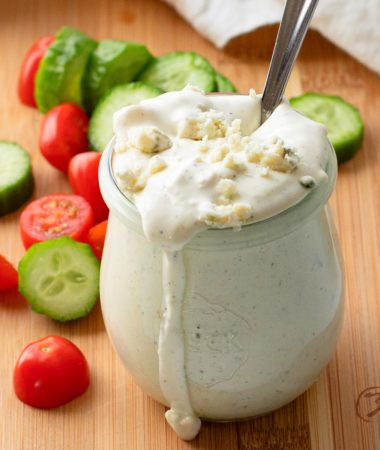 close-up of homemade blue cheese dressing in a glass jar