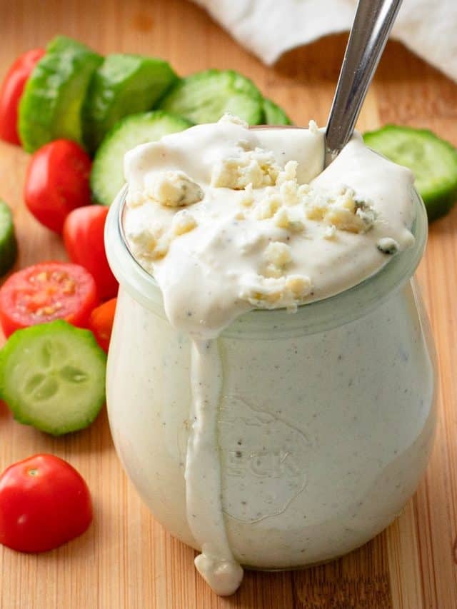 close-up of homemade blue cheese dressing in a glass jar