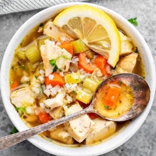 keto chicken vegetable soup in a bowl with a spoon on top