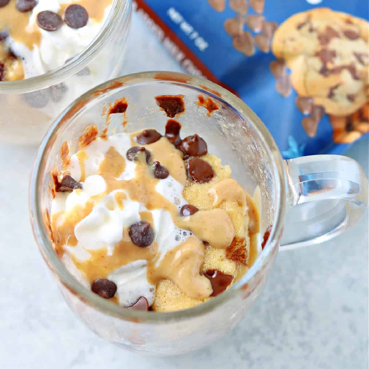 close-up of a peanut butter mug cake in a glass mug