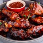 close-up of air fryer keto bbq chicken wings in a metal pan