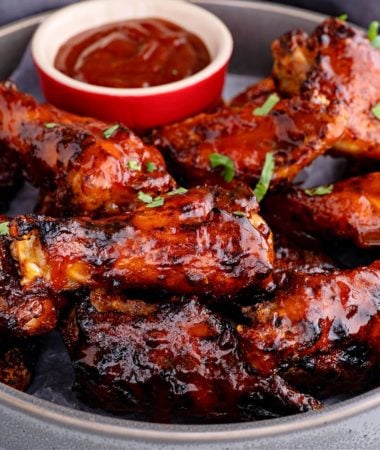 close-up of air fryer keto bbq chicken wings in a metal pan