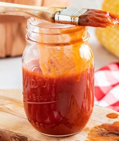 a close-up of keto bbq sauce in a glass jar