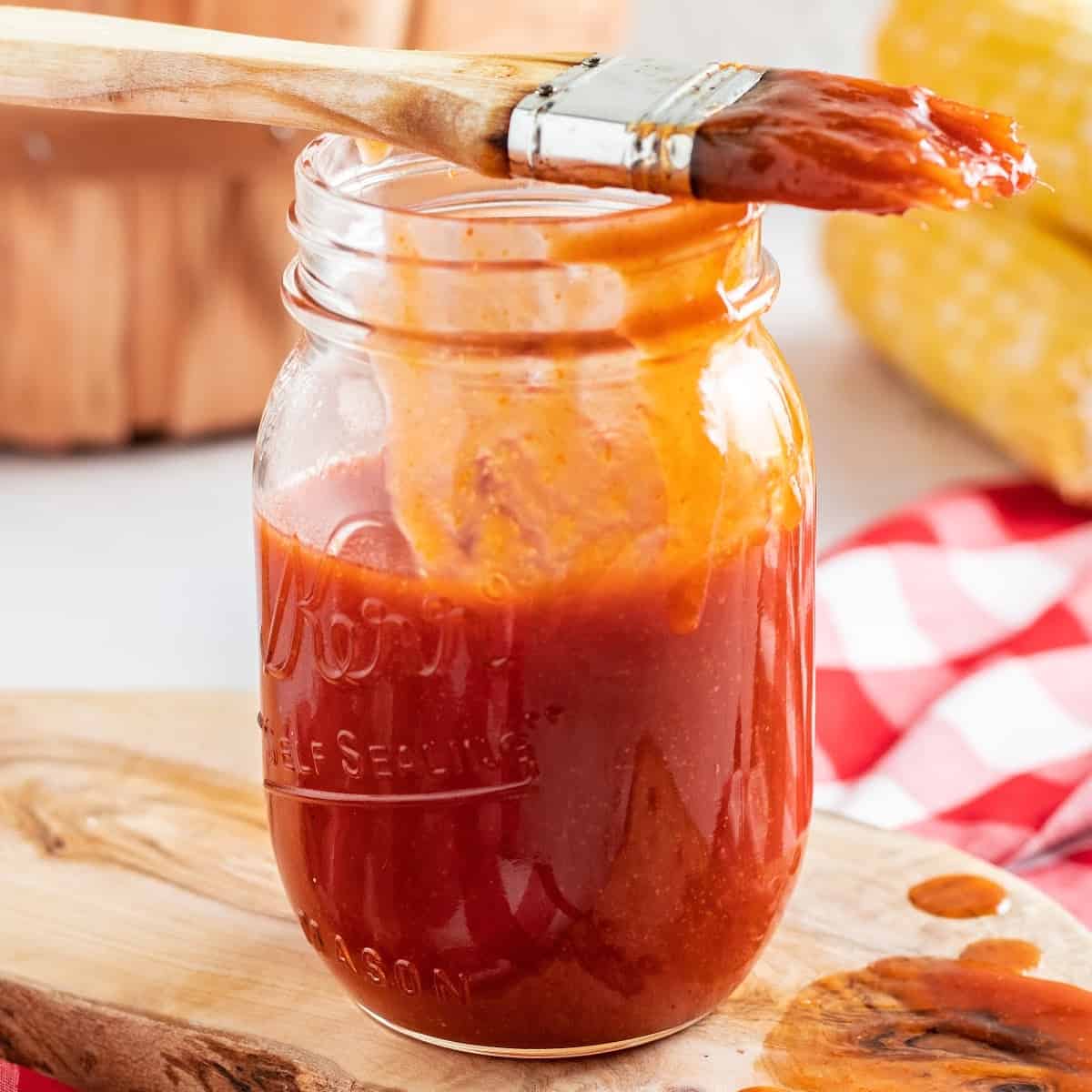 a close-up of keto bbq sauce in a glass jar