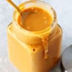 easy chick-fil-a sauce recipe in a glass jar with a spoon