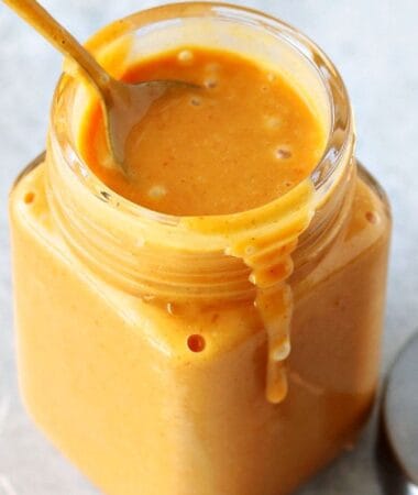 easy chick-fil-a sauce recipe in a glass jar with a spoon