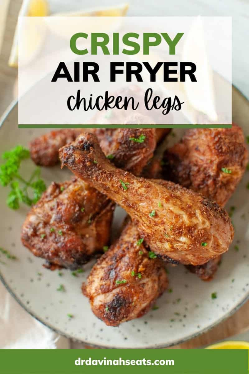 A poster with a picture of chicken legs on a plate with a banner that says "Crispy Air Fryer Chicken Legs"