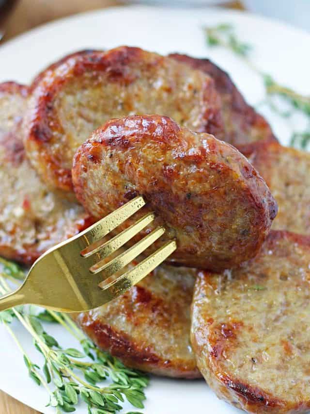 close up of browned air fryer sausage patties on a plate