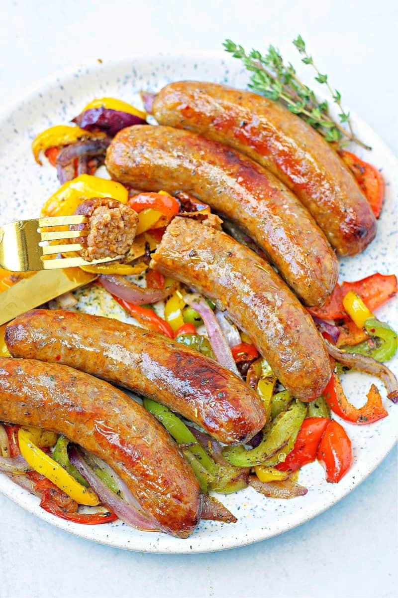 a plate of air fryer Italian sausages with peppers and onions