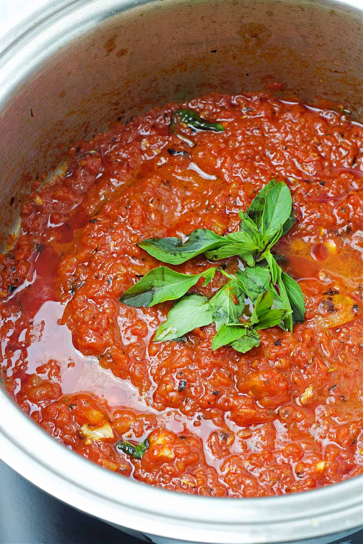 keto marinara sauce in a plan with basil on top