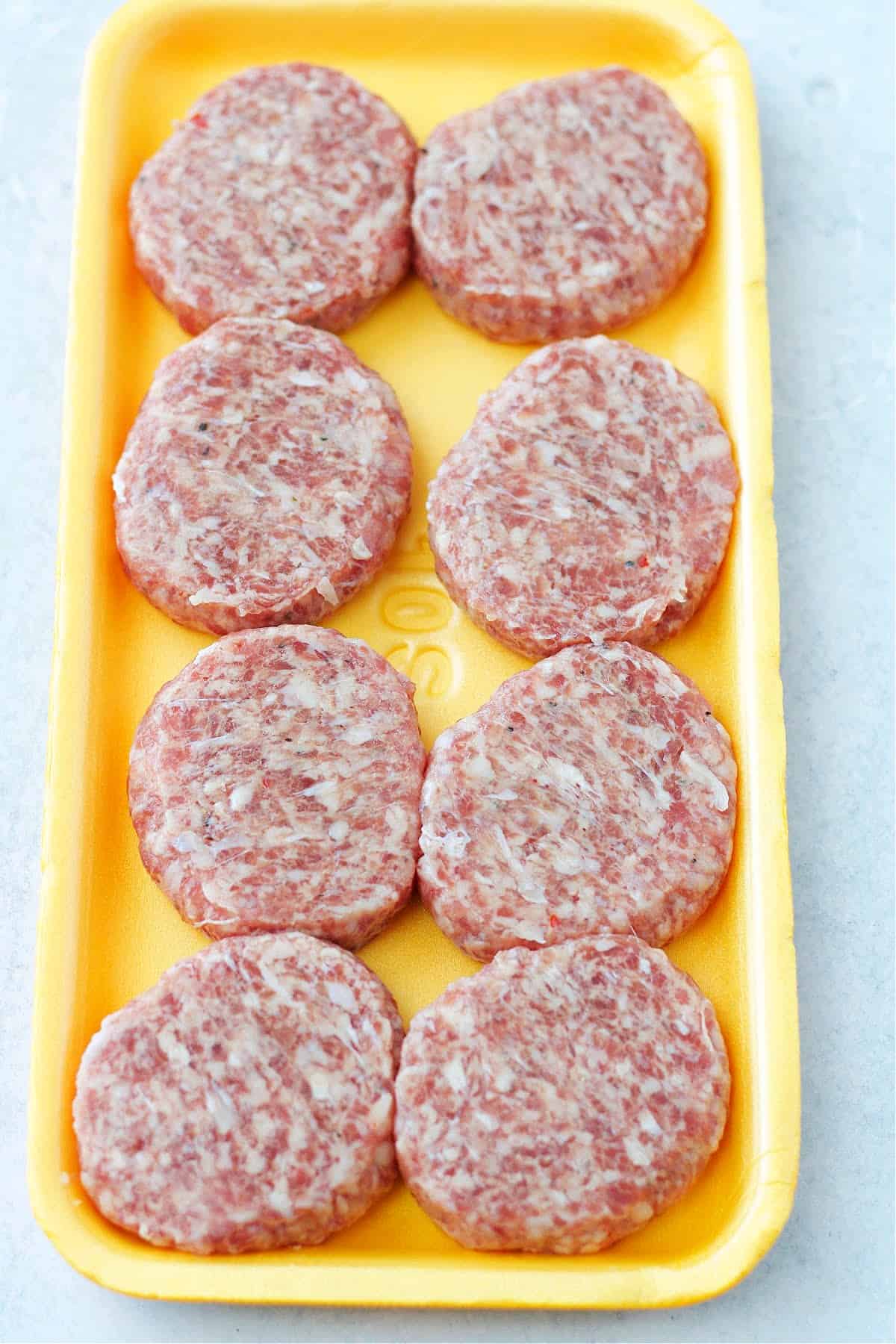 fresh breakfast sausage patties in a tray