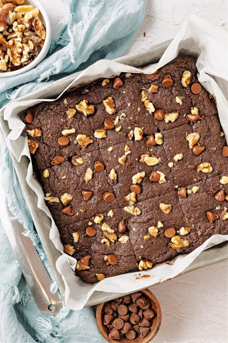 almond flour brownies in a pan with walnuts and chocolate chips