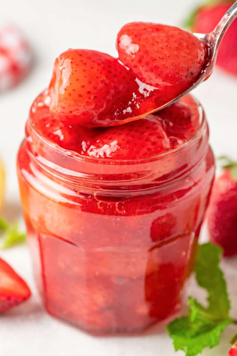 sugar free strawberry sauce in a jar with a spoon