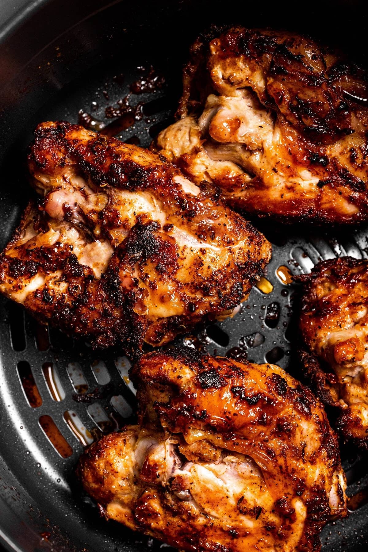 Air Fryer Chicken Thighs in the Ninja Foodi cooking basket