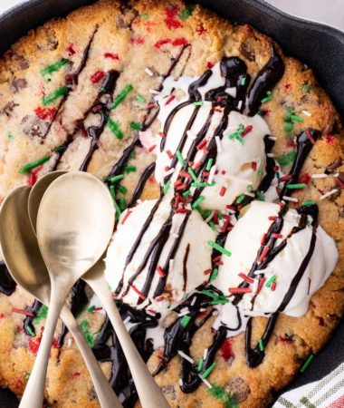 close up of Keto Christmas skillet cookie with ice cream and chocolate syrup