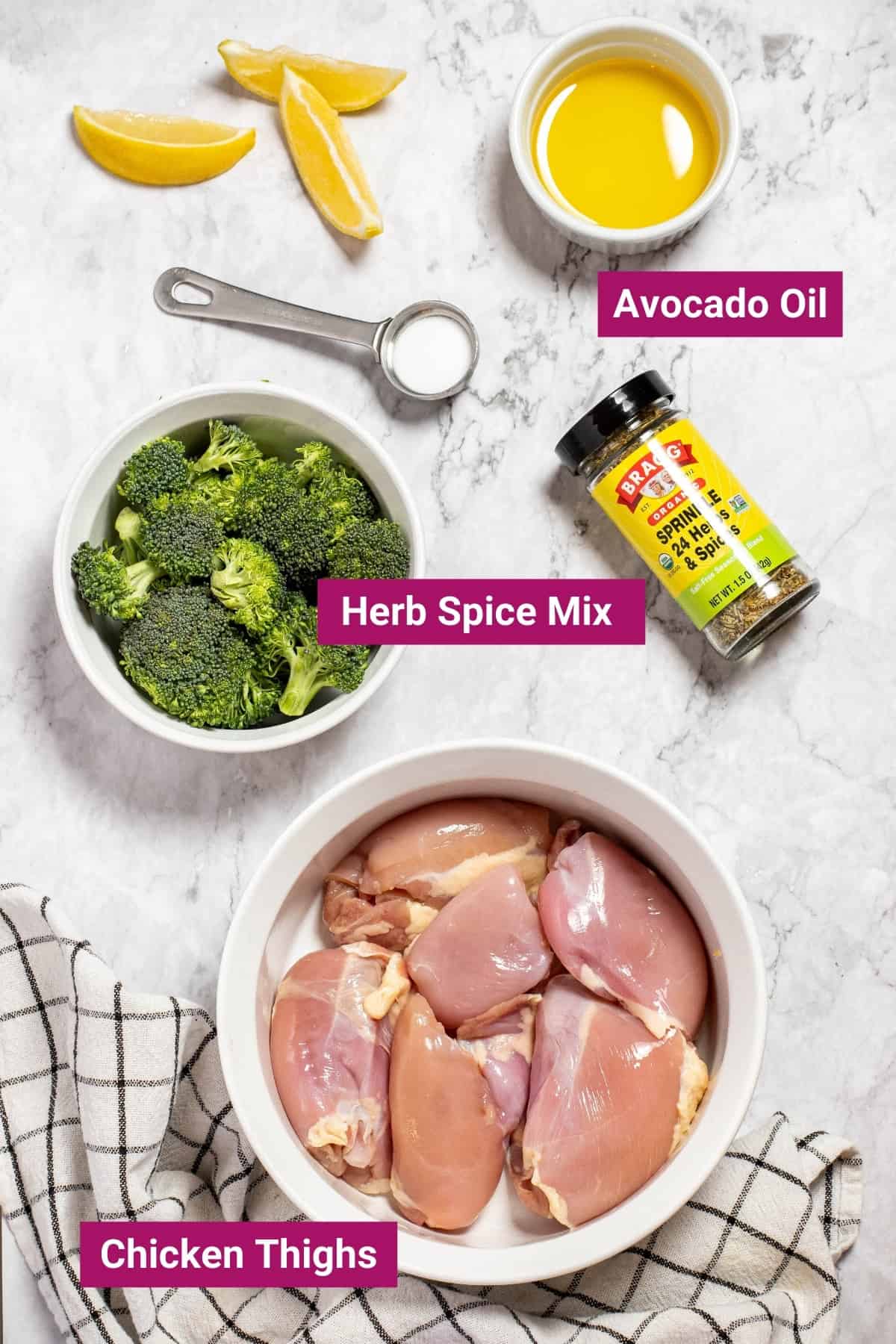 air fryer boneless chicken thigh ingredients like cooking oil, salt, 24 herb seasoning, and boneless skinless chicken thighs in separate bowls with a broccoli side dish