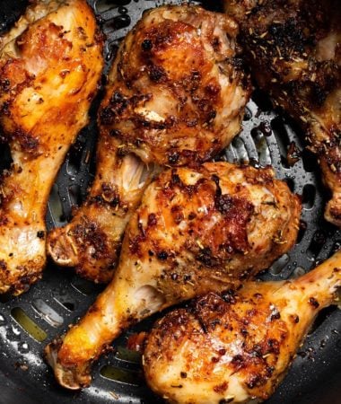 close up of air fryer roasted chicken drumsticks in the ninja foodi
