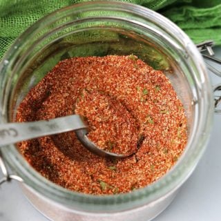 close-up of cajun seasoning in a glass jar