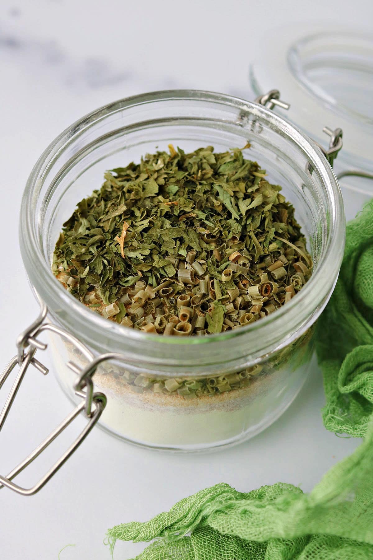 spices for ranch seasoning recipe in a glass jar before being mixed