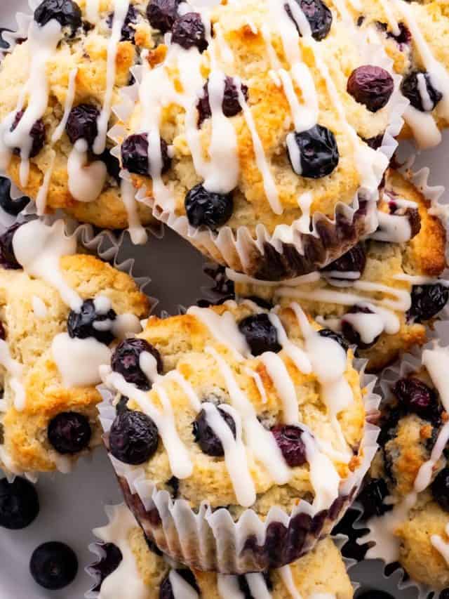 almond flour keto blueberry muffins on a plate with keto glaze