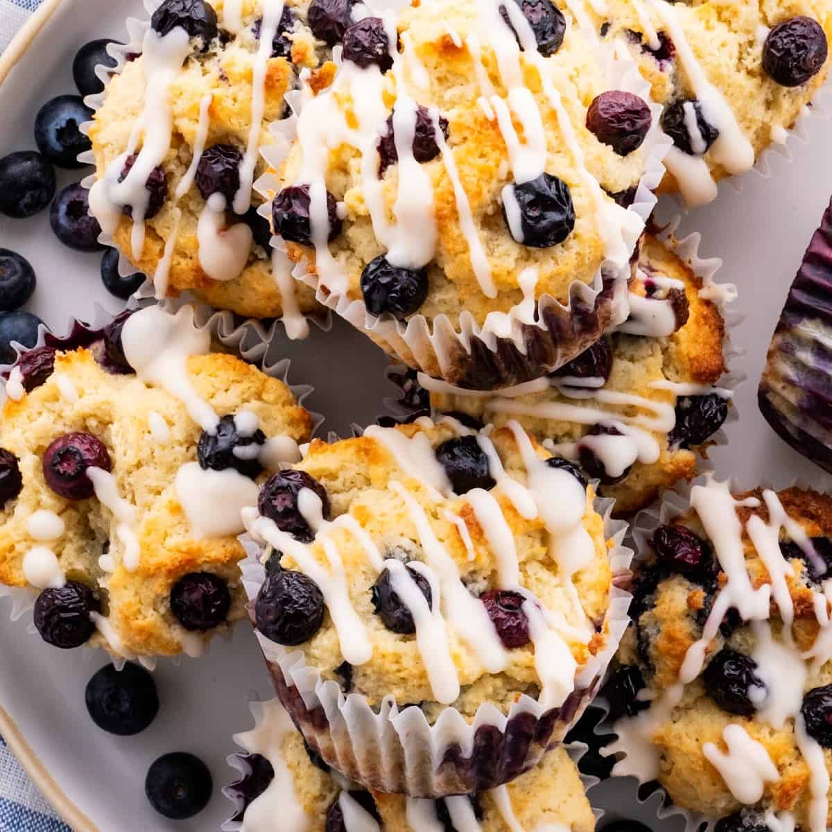 almond flour keto blueberry muffins on a plate with keto glaze