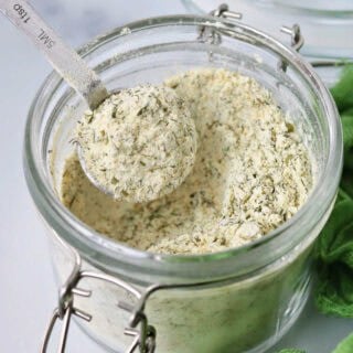 close-up of a glass jar filled with mixed ranch seasoning spice mix