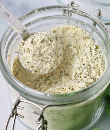 close-up of a glass jar filled with mixed ranch seasoning spice mix