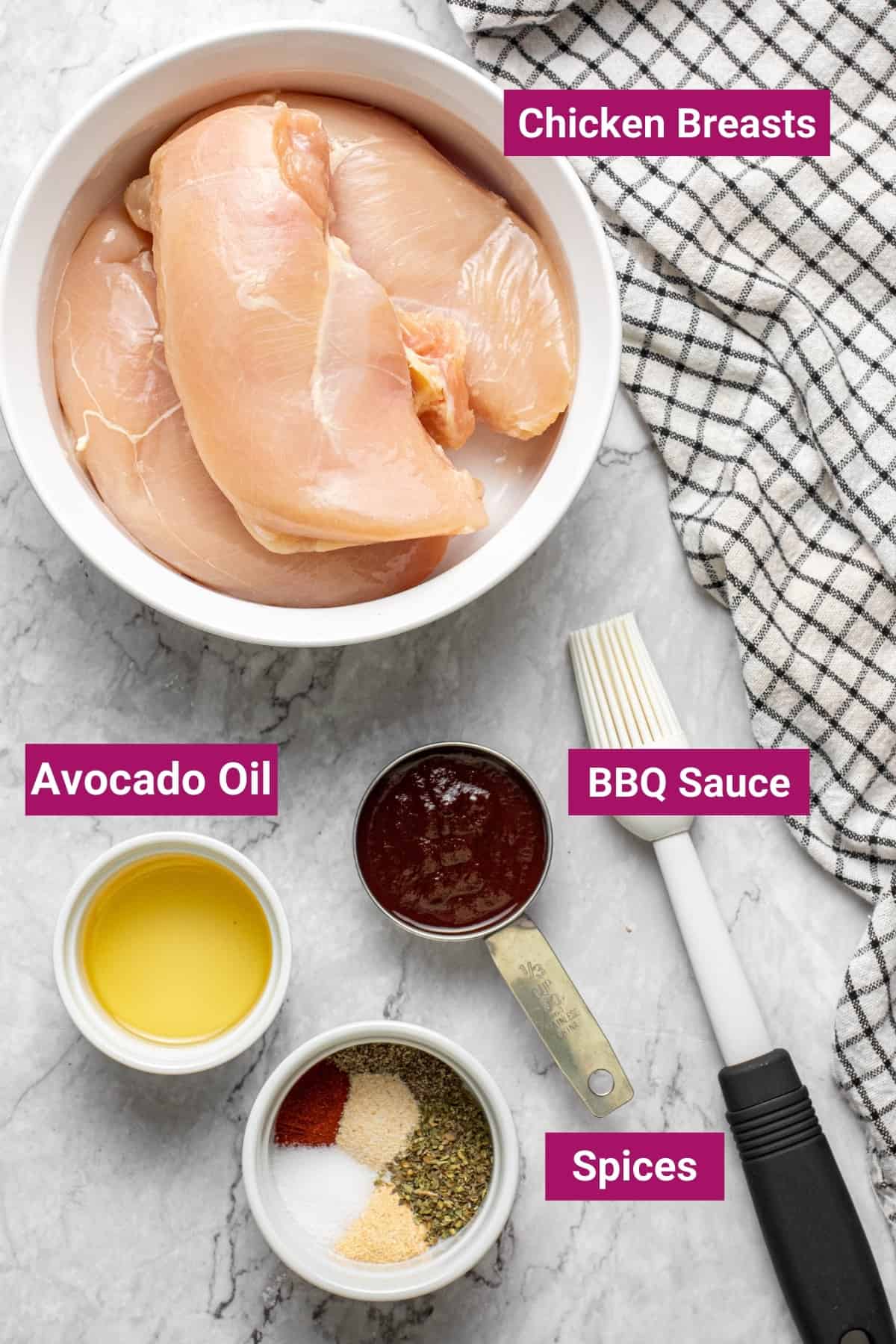 raw boneless chicken breasts, avocado oil, bbq sauce, and spices in separate bowls
