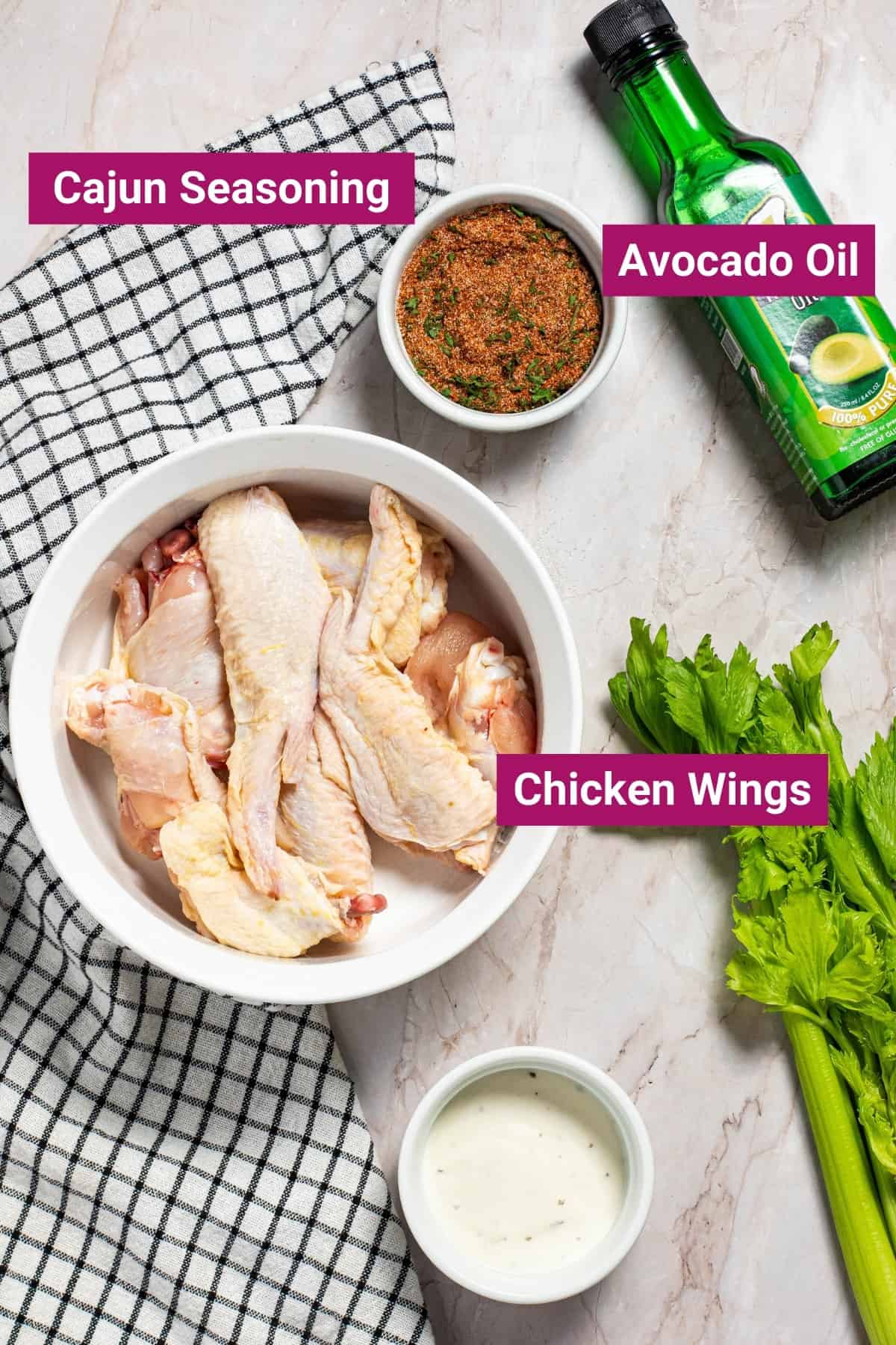 chicken wings, cajun seasoning and a bottle of avocado oil