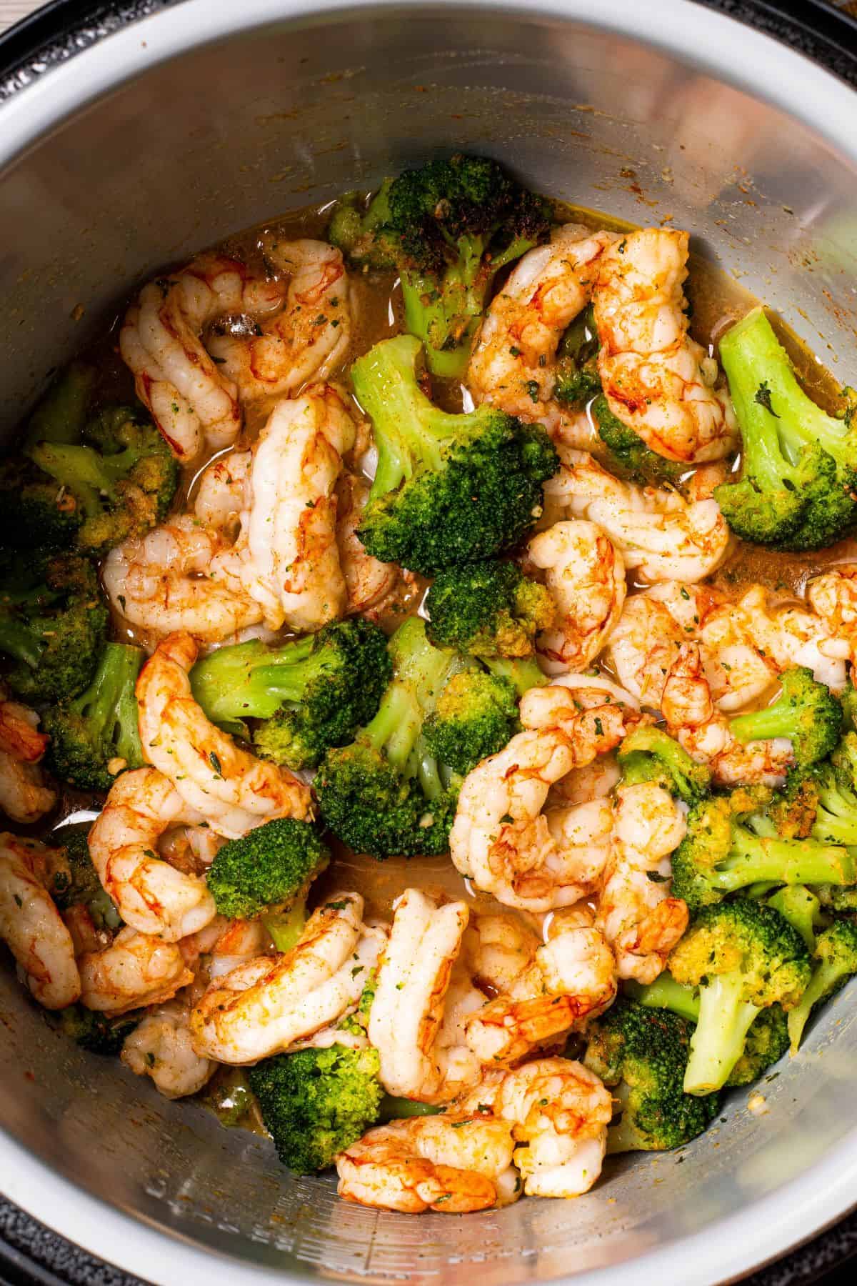 cooking seasoned Cajun Shrimp & Broccoli in an air fryer