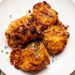 garlic butter chicken on a white plate