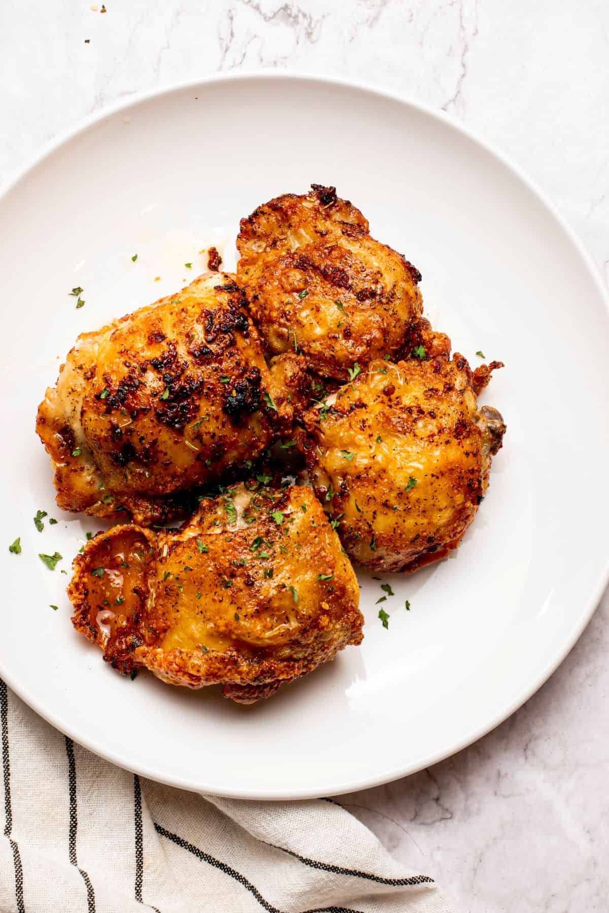 yummy and crispy Air Fryer Garlic Butter Chicken on a white plate
