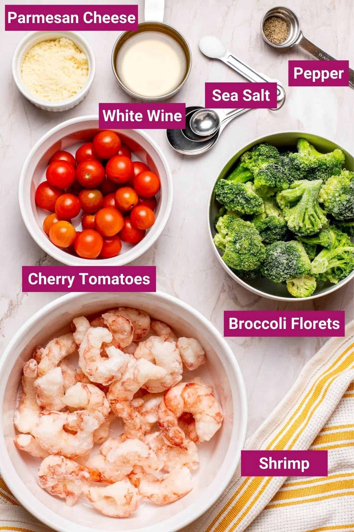parmesan cheese, white wine, cherry tomatoes, sea salt, pepper, shrimp, and broccoli on separate bowls