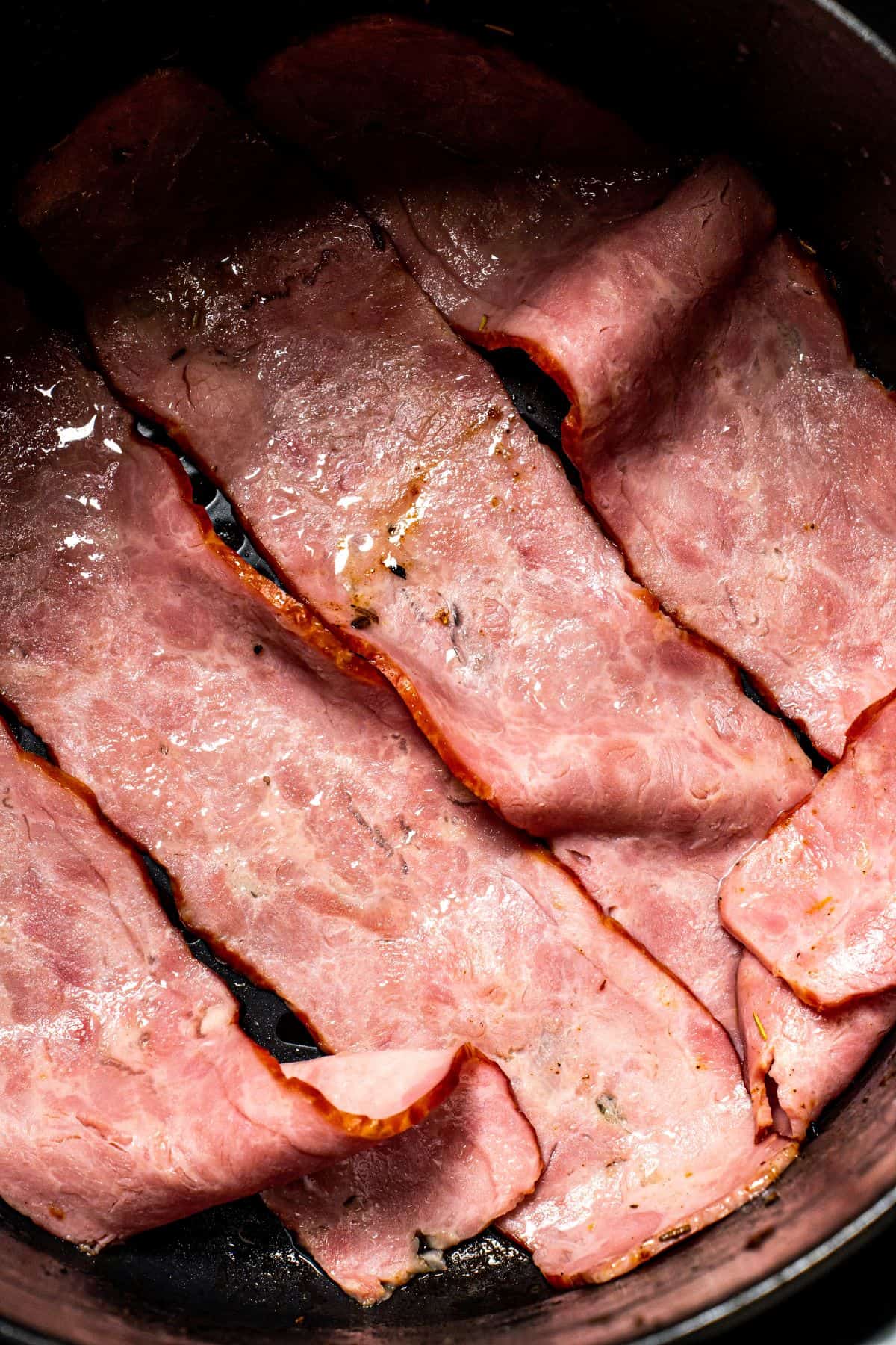 bacons with sides browning in an air fryer