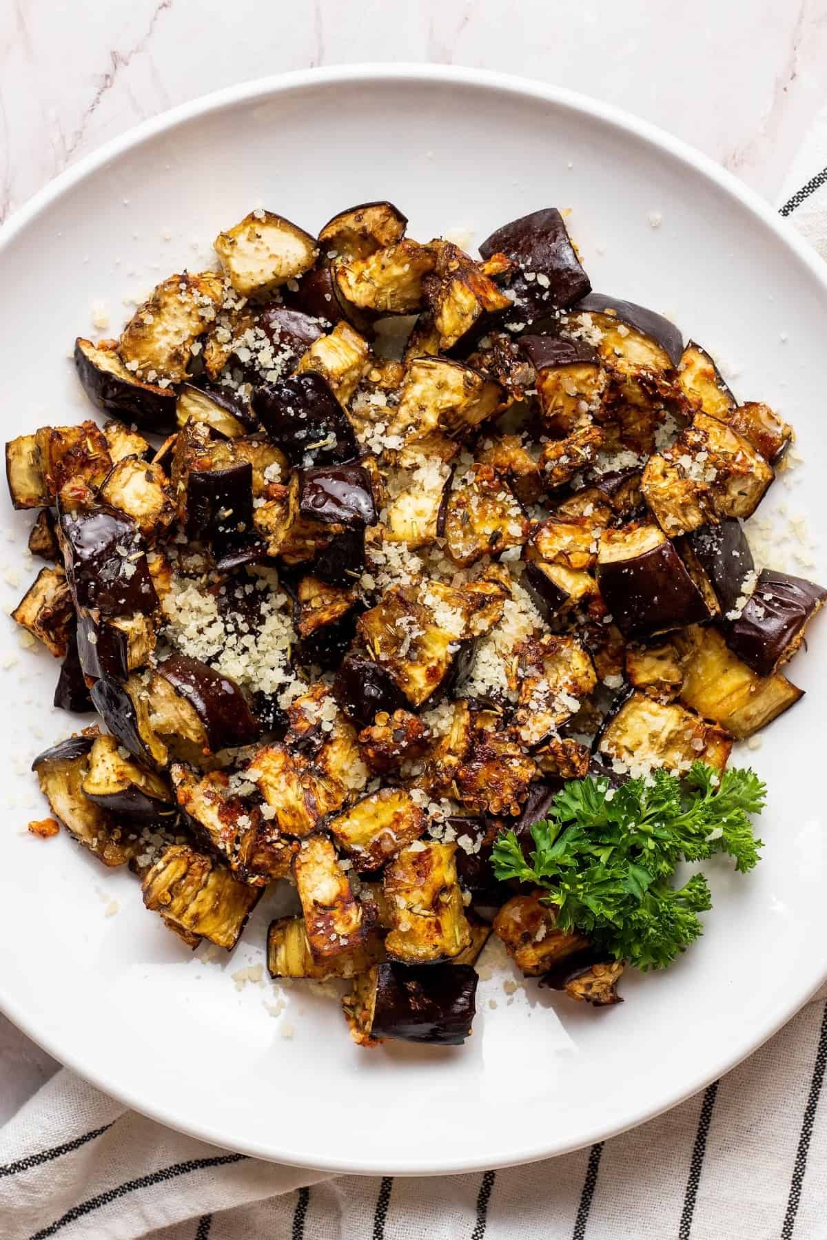 air fryer eggplant on a plate with parsley